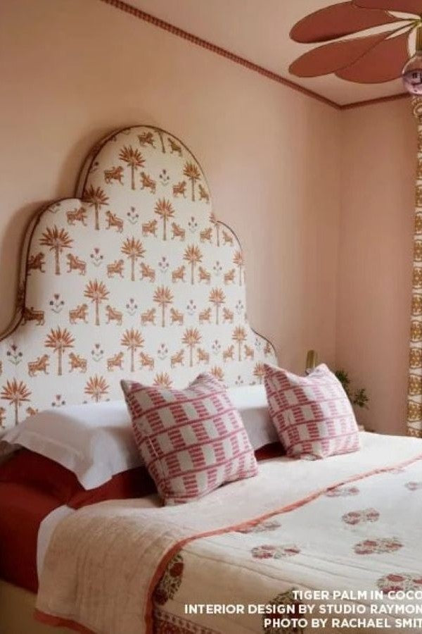 Custom statement headboard upholstered in luxury Schumacher fabric
