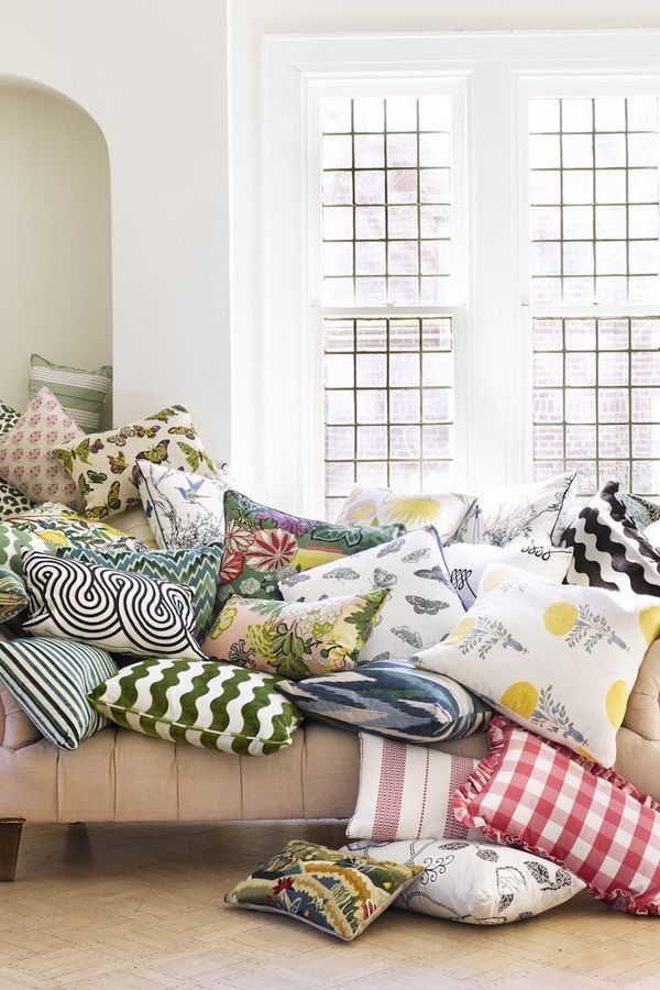 Schumacher luxury decorative throw pillows in colorful floral, botanical, geometric and embroidered patterns.