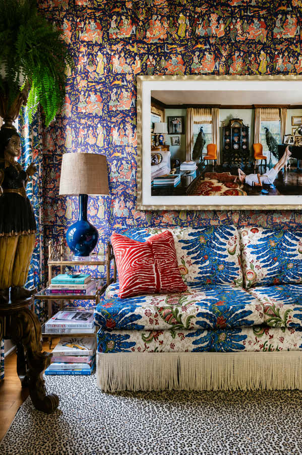 Brunschwig & Fils patterned sofa with fringe trim in a maximalist living room