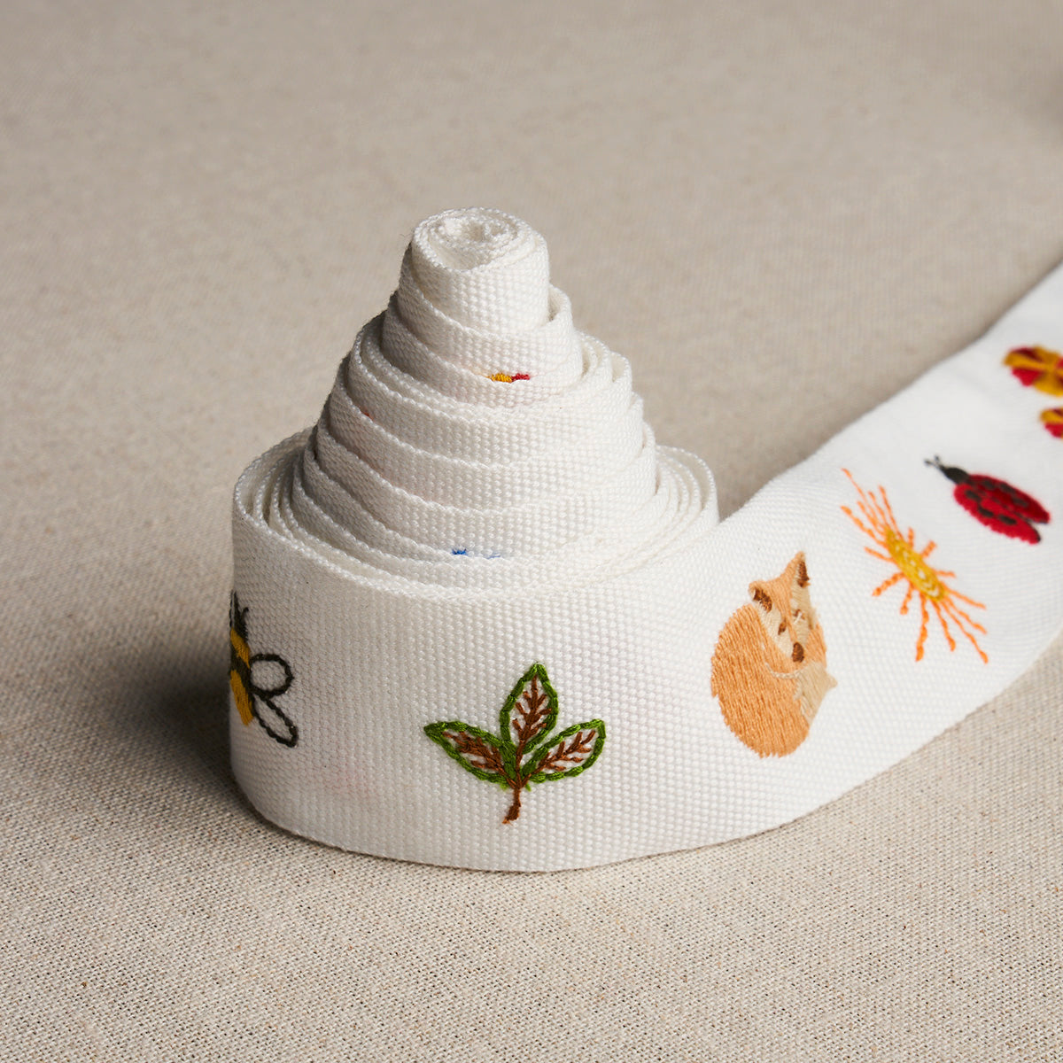 TINY-THINGS-EMBROIDERED-TAPE-MULTI-ON-IVORY-SCHUMACHER-81680 - Schumacher Trim
